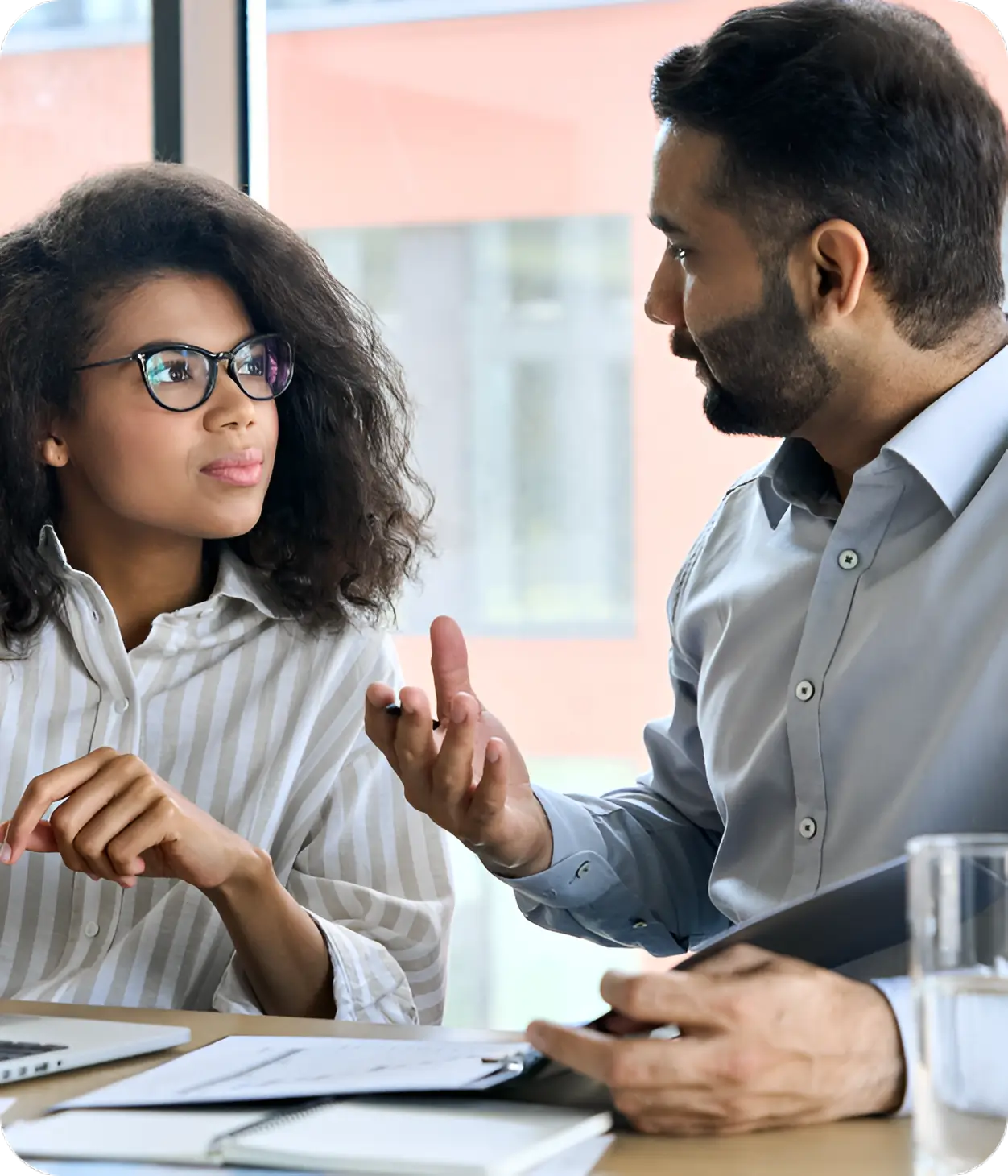 A man and woman are sitting at a table