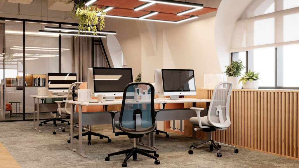 Modern office workspace with ergonomic chairs and wooden desks.