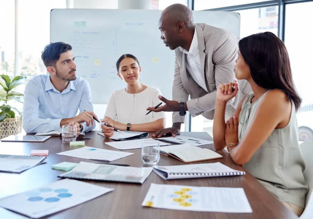 A group of people sitting around a table.